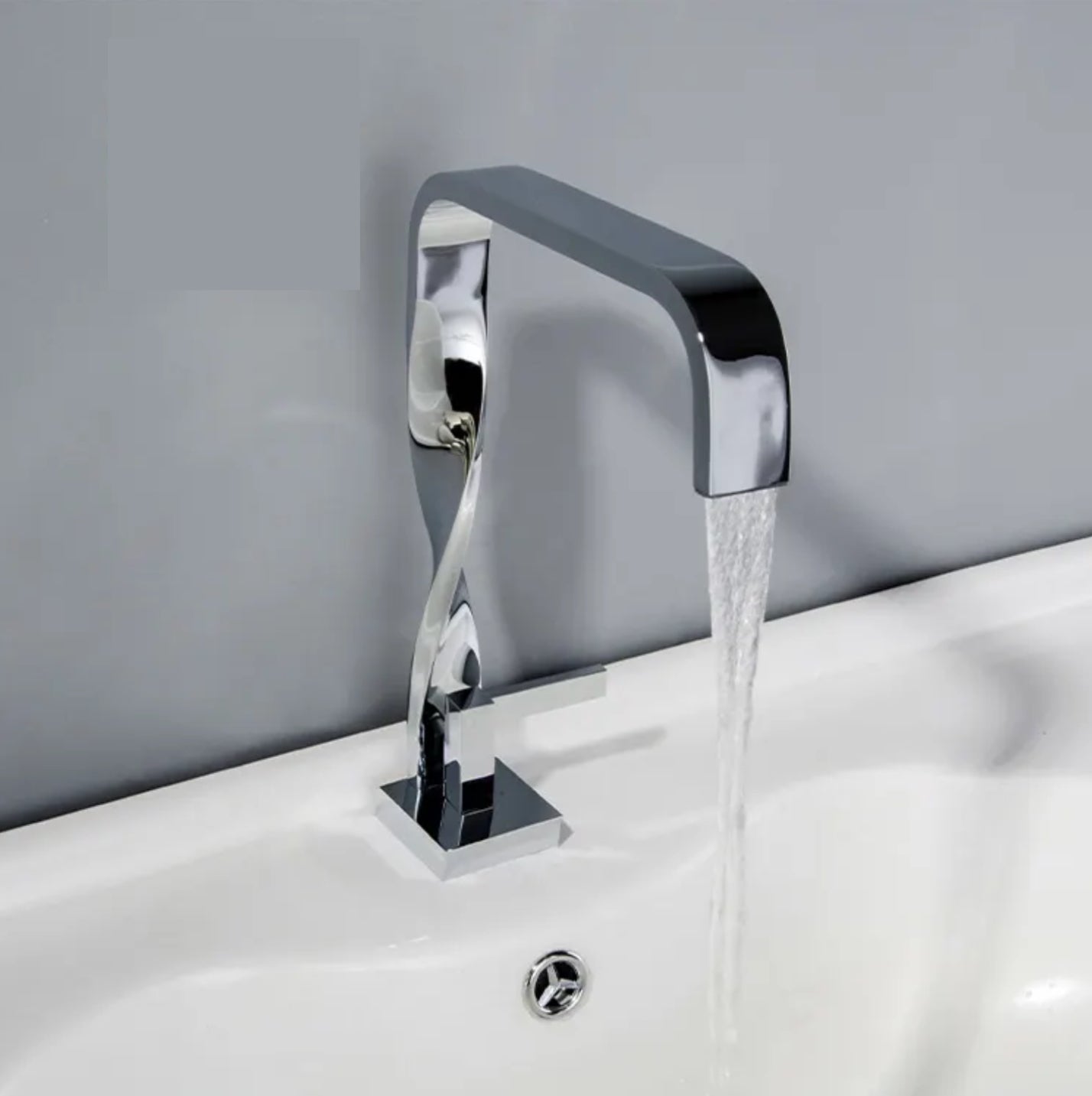 Grifo para lavabo de repisa 036 en latón cromado de la colección Enipée 